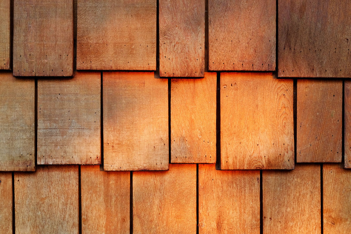 Abstract wooden texture of red cedar shingles, shake wood siding row roof panel