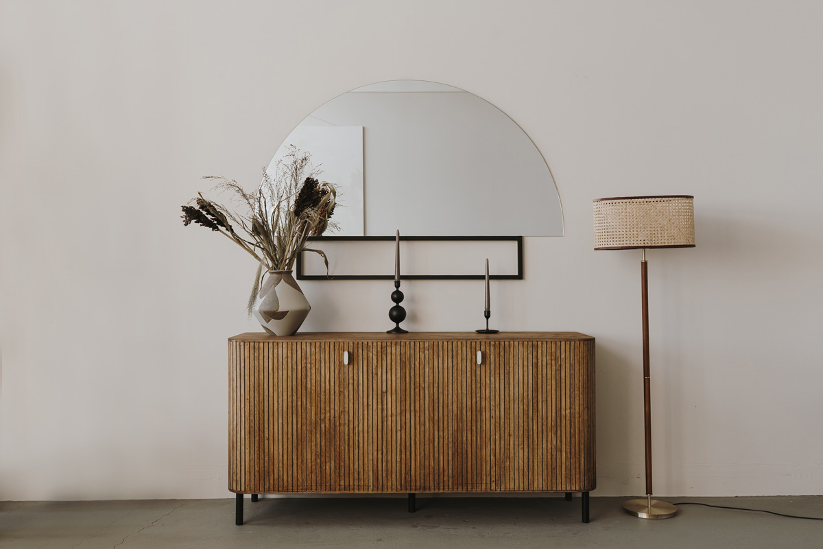 Aesthetic modern Scandinavian home interior design. Elegant bohemian living room with wooden console, mirror