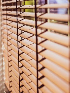 An off focus photo of venetian blinds, How To Install Venetian Blinds [5 Easy Steps]