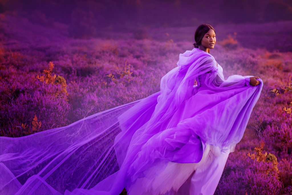 Beautiful black female fantasy princess in a rural fairytale heather parkland setting