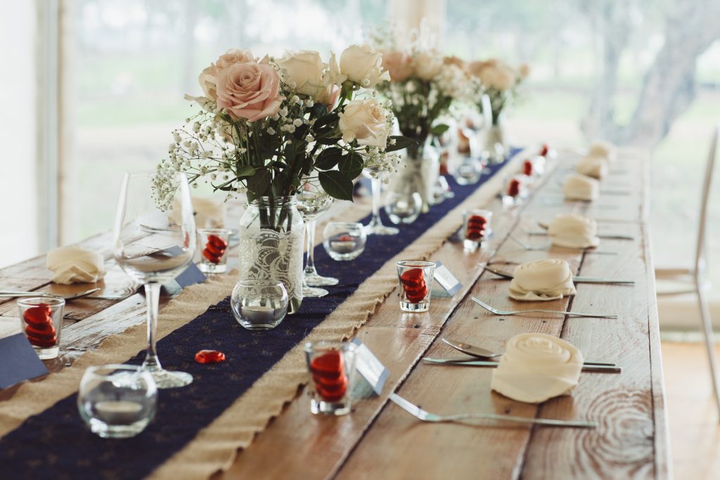 Beautiful wedding table place settings in a rustic country style.