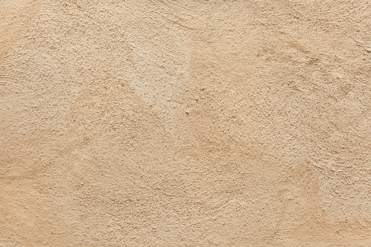 Beige painted stucco wall. Background texture.