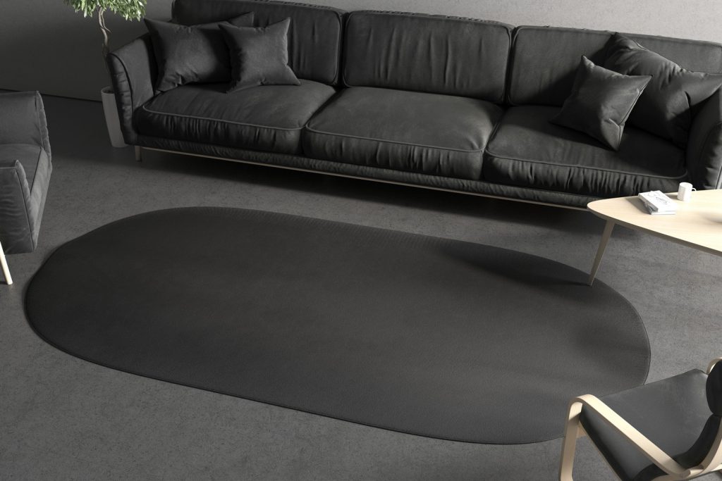 Blank black oval interior carpet in room mockup, side view