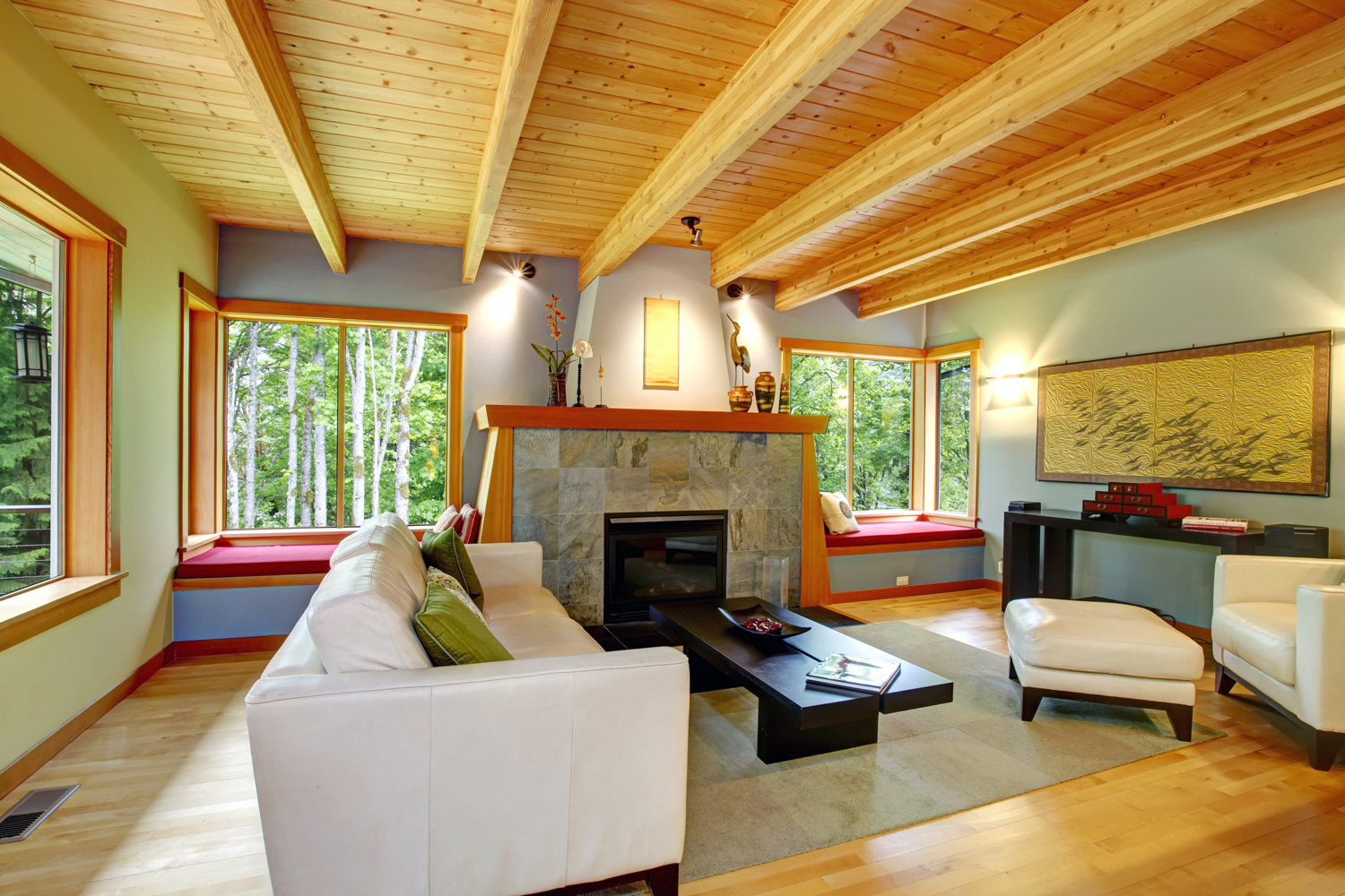 Blend of log cabin interior with elegant black and white furniture.