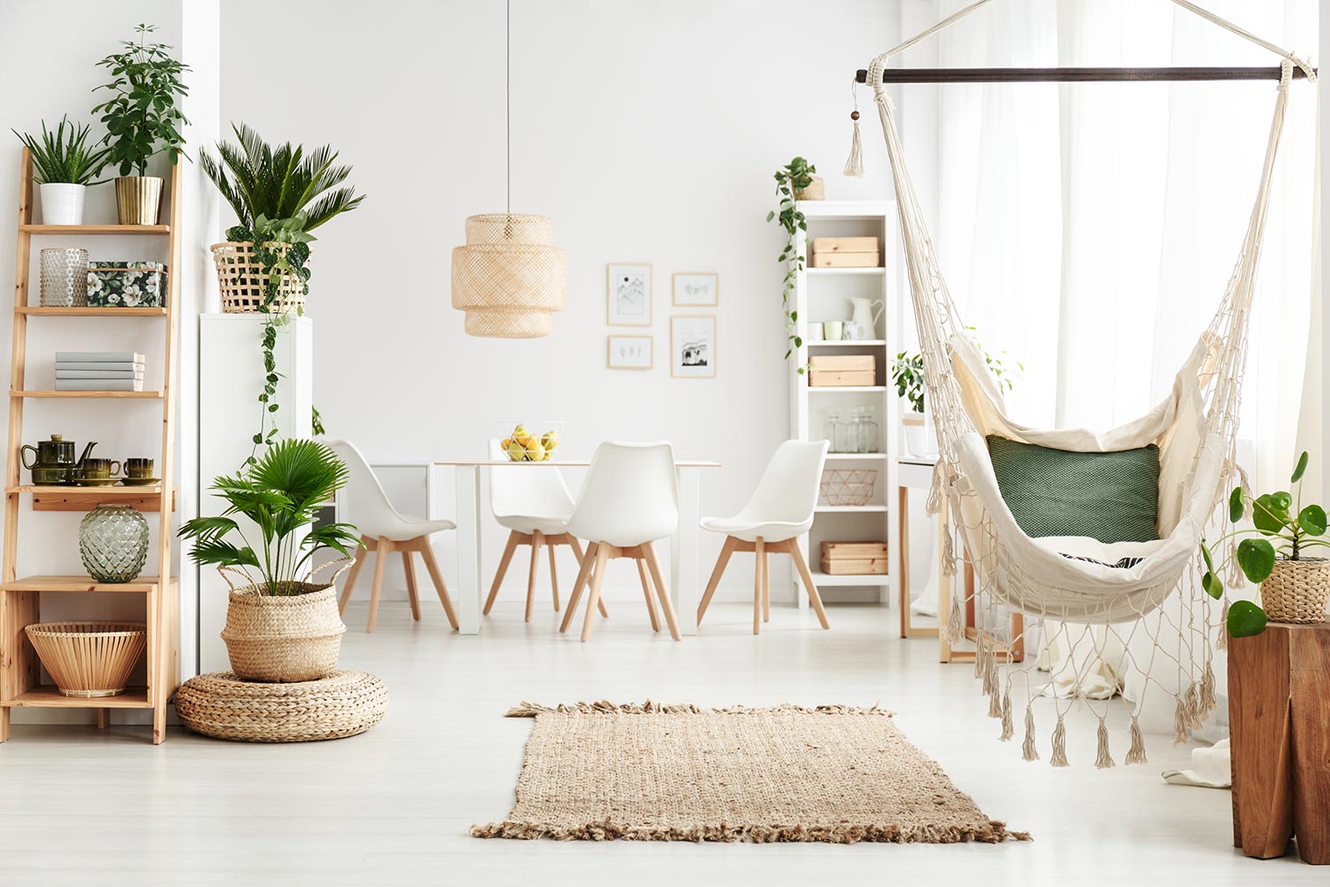 Brazilian chair hanging in white dining room