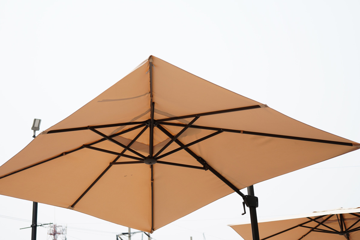 Brown square umbrella on sky