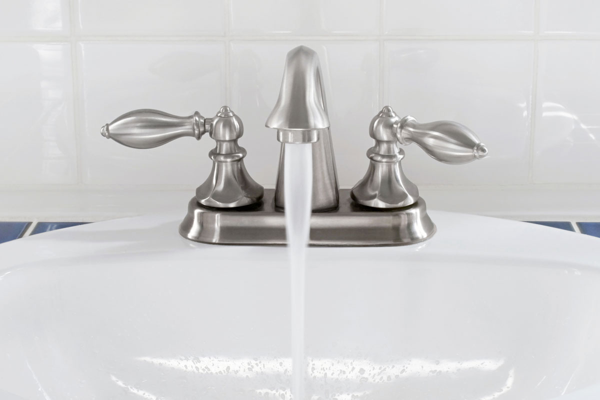Brushed Nickel Faucet with Running Water