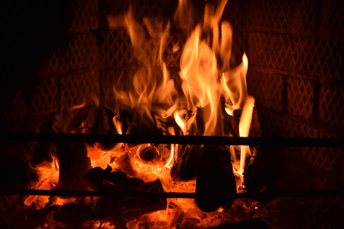 Burning logs at a fireplace