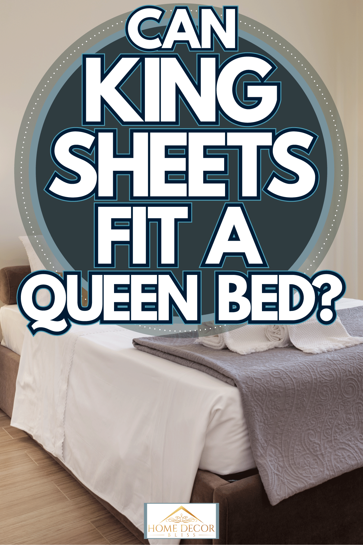 A modern bedroom with laminated flooring, white walls and a queen sized bed with white and gray beddings, Can King Sheets Fit A Queen Bed?