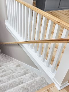Carpet stair runway with brown stair railings and white painted banister, What Color To Paint Stair Railing? [4 Design Options]