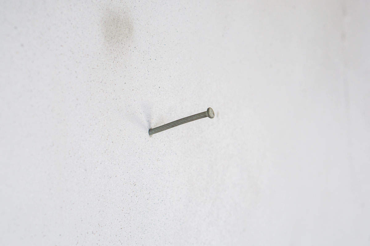 Concrete nail on the wall