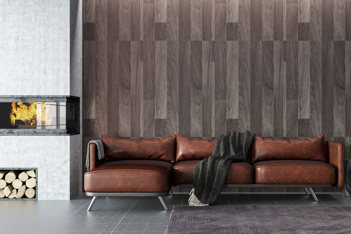 Contemporary inspired living room with wooden paneled wall, brown leather sofa and gray tile flooring