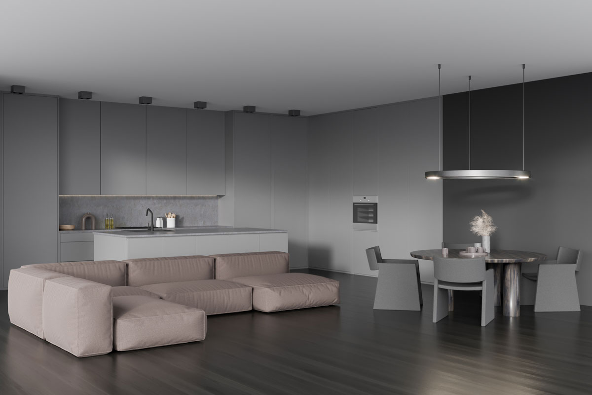 Corner view on dark kitchen room interior with sofa, dining table with armchairs, cupboard, oven, grey wall, sink, oil and oak wooden