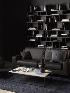 A dark living room interior with a leather sofa, seat and coffee table, 21 Amazing Dark Living Room Ideas
