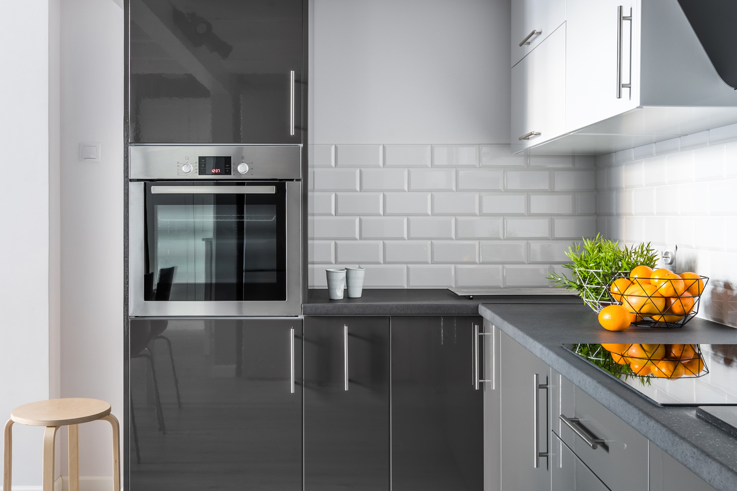 Elegant kitchen interior with brick tiles and modern cupboards