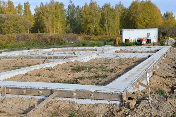Foundation of a house under construction, How And What To Plant Around House Foundation