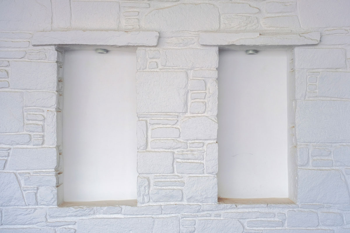 Greek Architectural Window design whitewashed stone wall