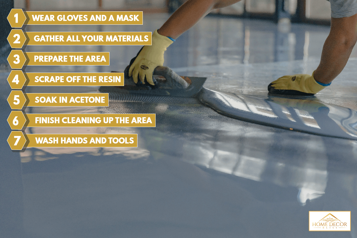 Worker applies gray epoxy resin to the new floor, How To Clean Up After Epoxy Resin