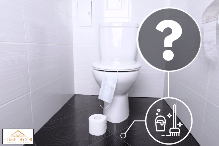 White home toilet with flush and white toilet paper and disposable medical mask in the bathroom, How To Clean Your Bathroom Floor