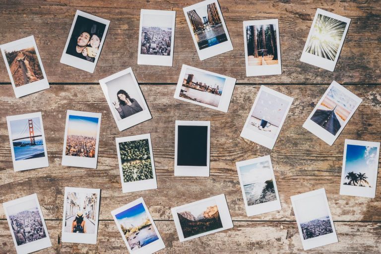 An instant camera prints on a wall, 15 Amazing Collage Wall Ideas
