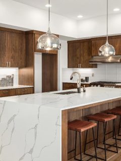 A kitchen in newly constructed luxury home, What Color Island Goes With Oak Cabinets?