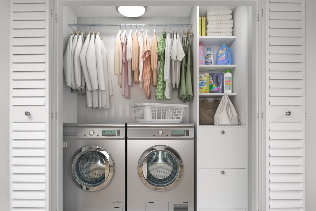 Laundry room with wood floor, washing machine at closet,white wall, shelving and clothes