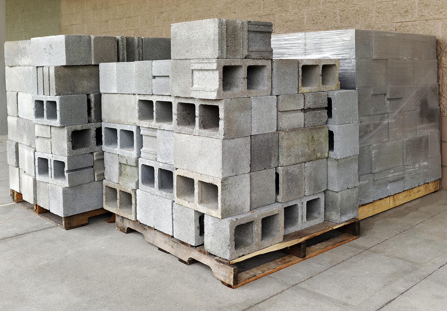 Merchant's stack display of concrete cinder blocks on wood palettes