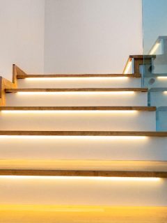 A modern illuminated wooden staircase indoor, What Is The Best Paint For Indoor Stairs?