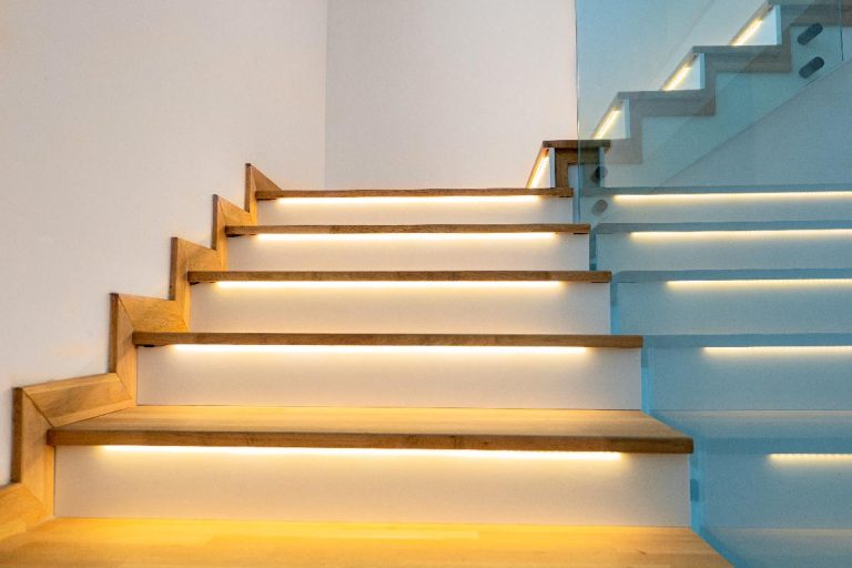 A modern illuminated wooden staircase indoor, What Is The Best Paint For Indoor Stairs?