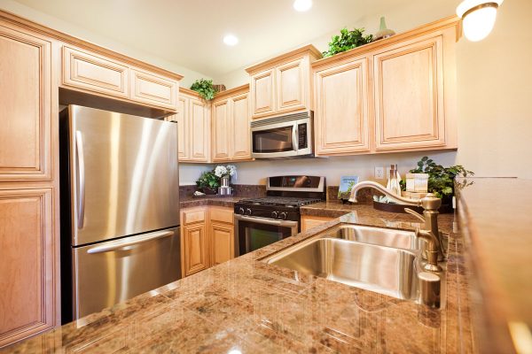 Modern luxury kitchen with granite counters, What Color Paint Goes With Brown Granite?