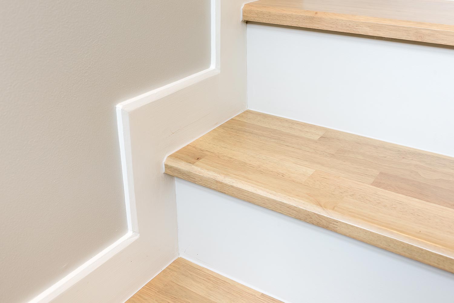 Modern stair design with wooden tread and white riser