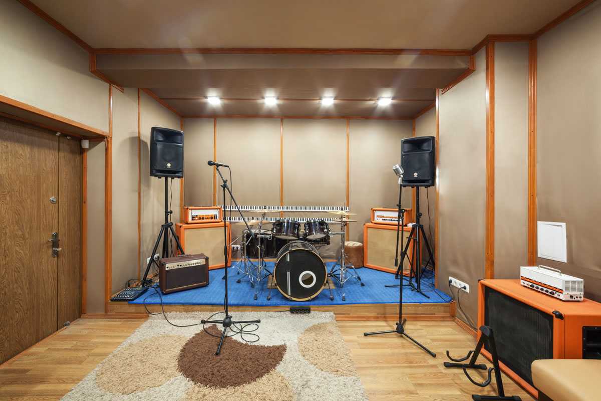 Music rehearsal space with drum kit and musical equipment