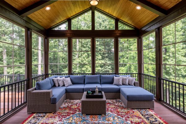New modern screened porch with patio furniture, summertime woods in the background. New home addition concept - 11 Awesome Patio Color Schemes