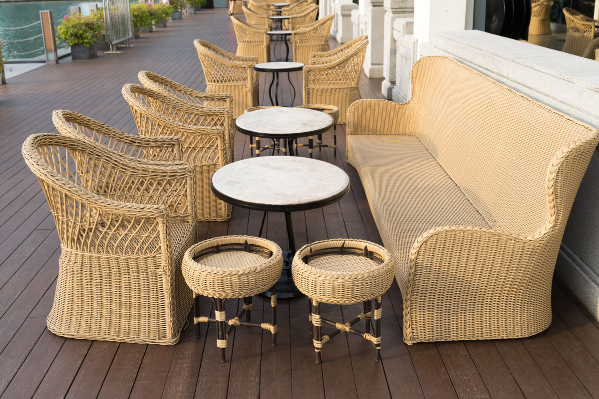 Outdoor dining with bamboo furnitures and white round tables