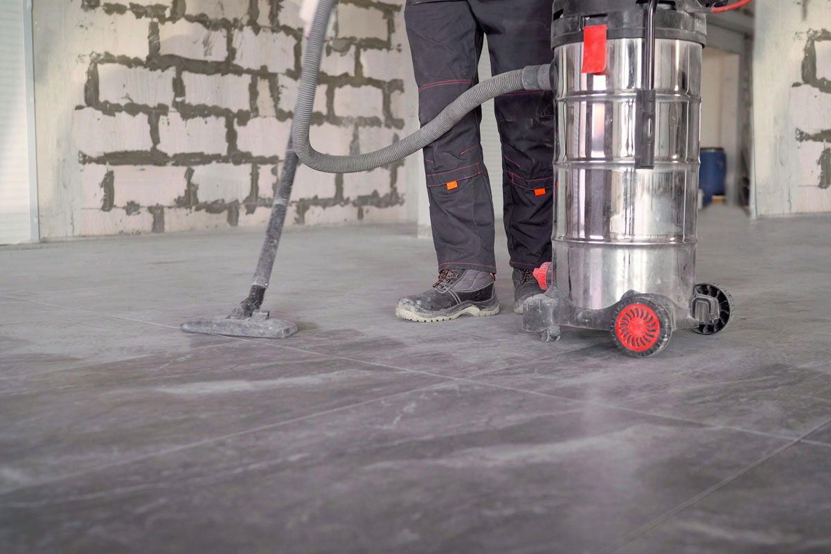 Professional cleaning of the premises after renovation with industrial vacuum cleaner