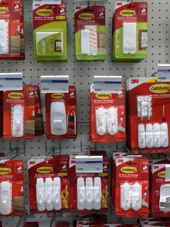 Row of Command brand Picture Hanging Strips and Hooks by 3M company on store shelf. 3M is the general public primarily known for the Post-it Notes and Scotch Tapes. - Can You Use Command Strips On Wallpaper