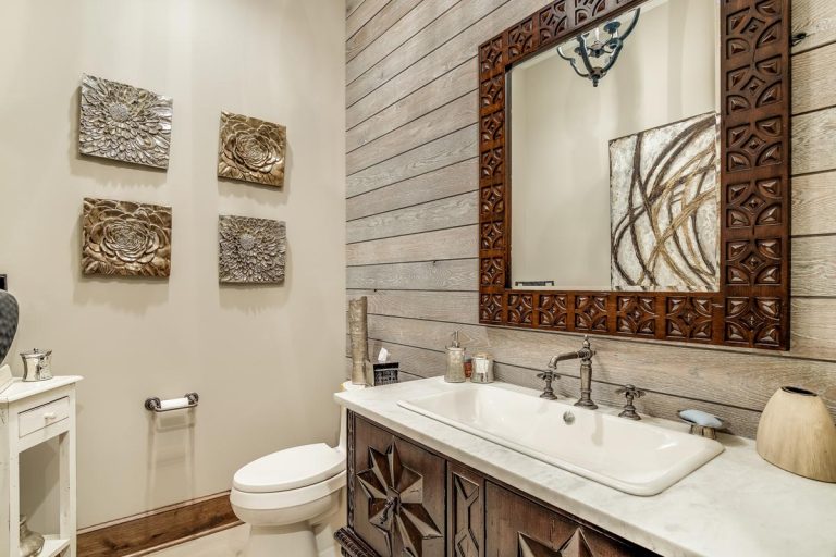 A rustic bathroom with a shiplap accent wall, Can You Put Shiplap Over Paneling?