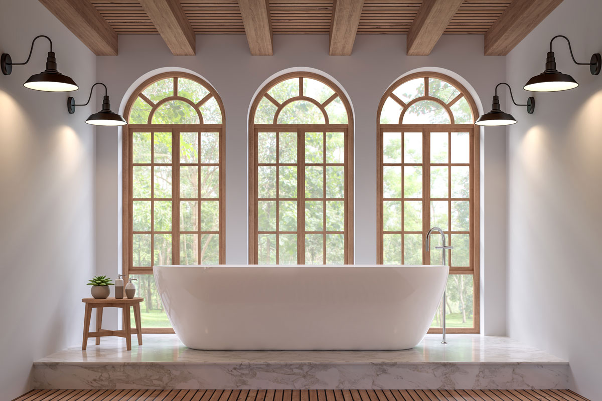 Scandinavian bathroom with 3 large window with a big bathtub