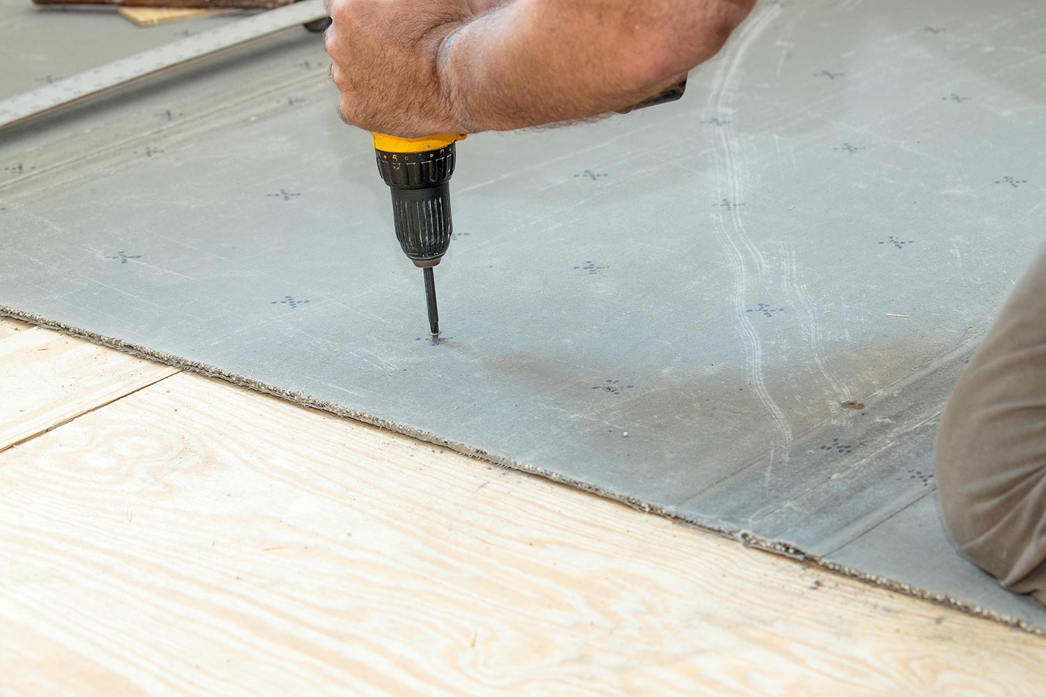 Screwing cement board to the subfloor