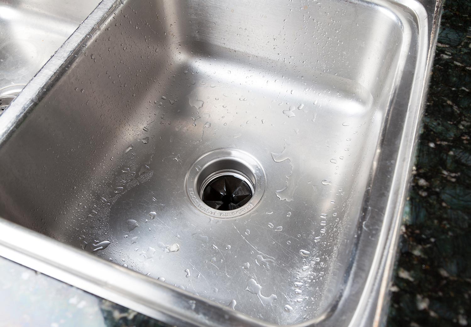 Stainless steal kitchen sink with water drops