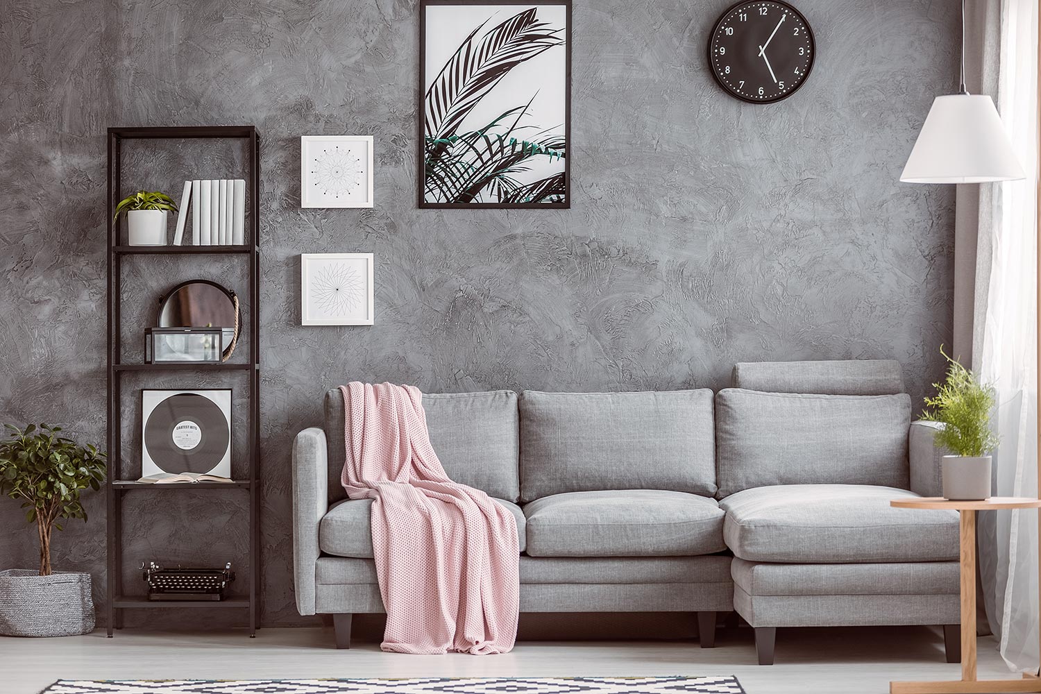Stylish living room with comfortable grey corner sofa