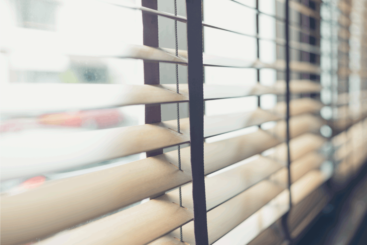 Sunlight coming through venetian blinds by the window. How To Whitewash Bamboo Blinds