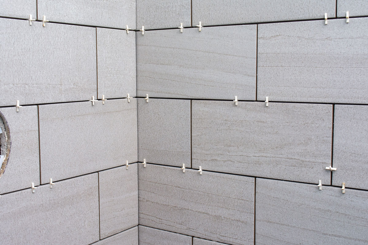 White tile spacers using for laying tiles