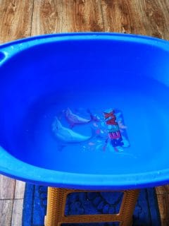 A blue colored baby bathtub, What To Put In Baby Bath Caddy [10 Essential Items]a