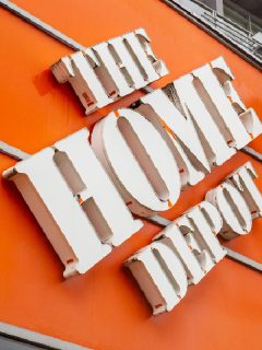 An american hardware giant The Home Depot store logo in front of the building, Does Home Depot Cut Wood For You?