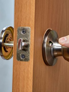 Assembling lock with door knobs and latch in living room, How To Unlock A Door With A Hole