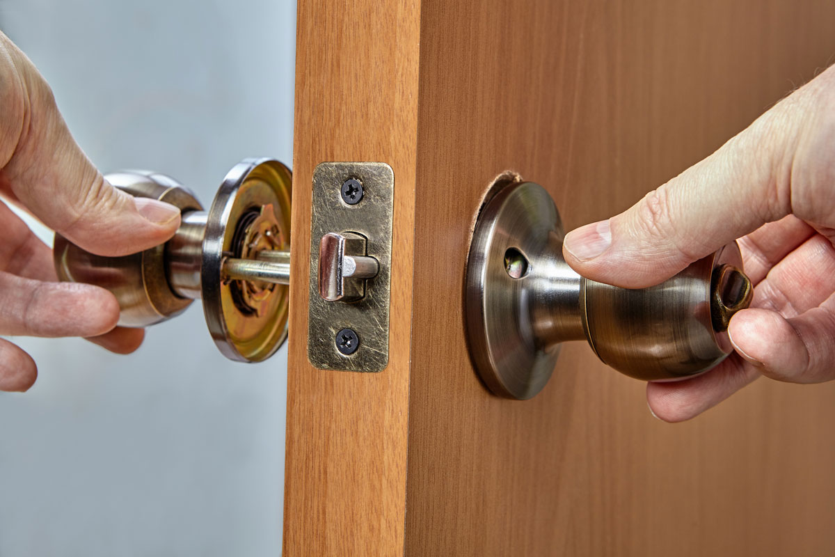 Assembling lock with door knobs and latch in living room