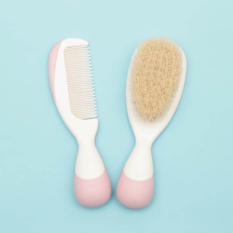 Baby grooming materials on a light blue background