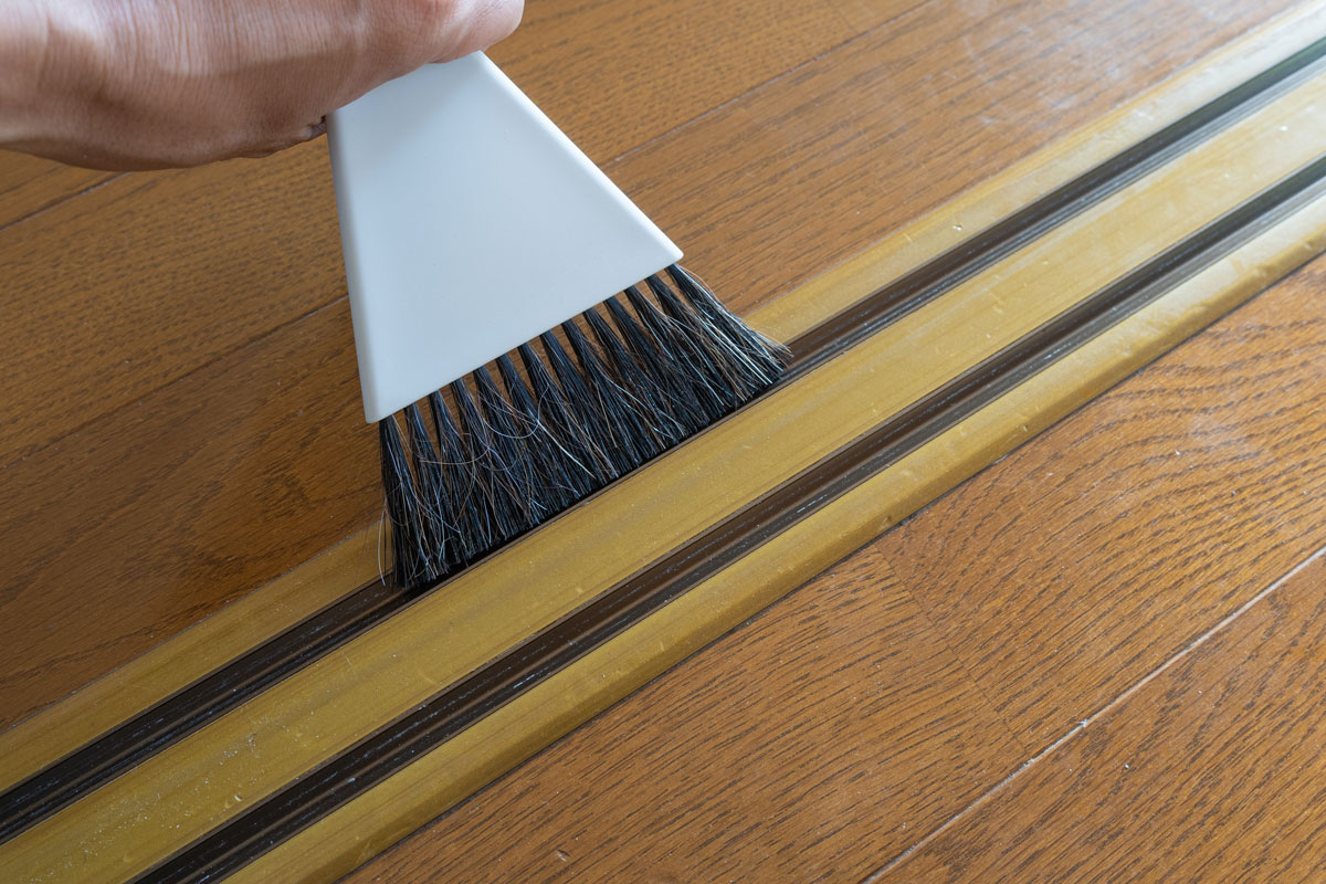 Cleaning a door sweep