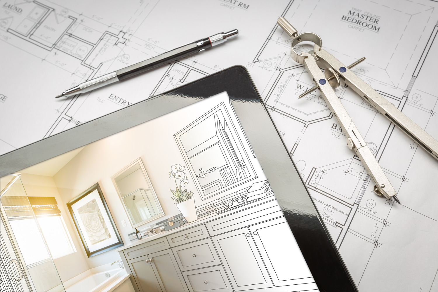 Computer Tablet with Master Bathroom Design Over House Plans, Pencil and Compass.
